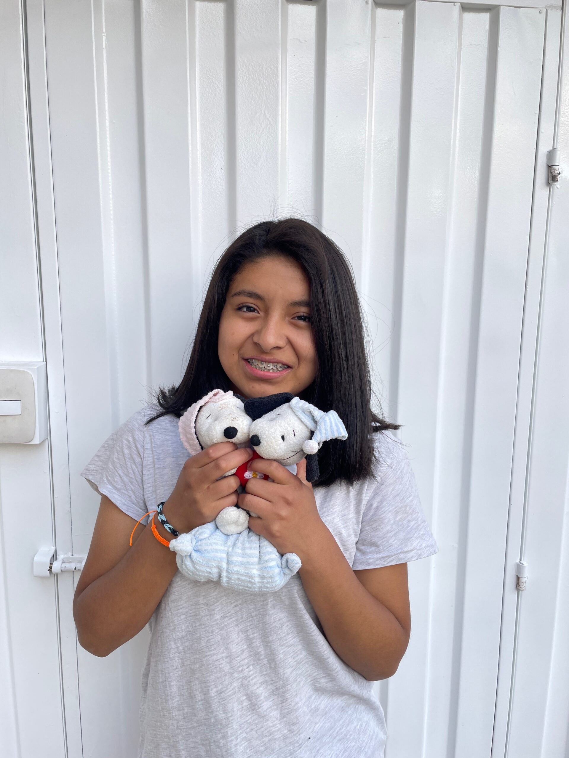 Girl smiling at Restoring Children International home in Peru