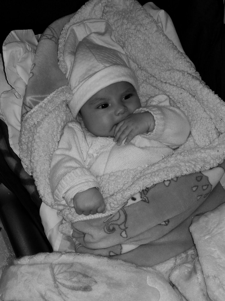 A baby bundled in blankets